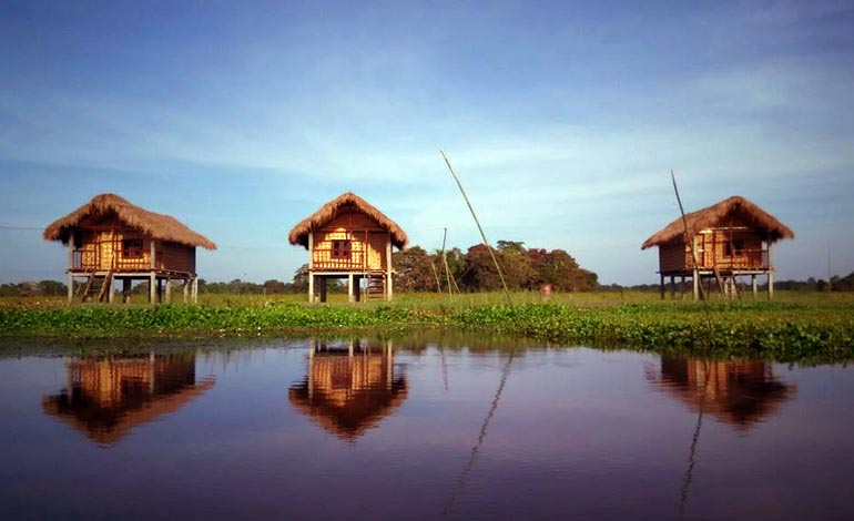  10 places to visit in india before they disappear majuli cottages