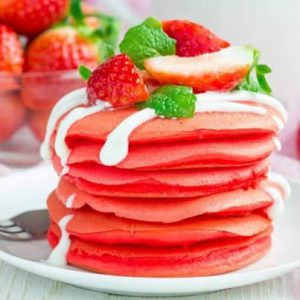 Strawberry pancakes with mint and cream